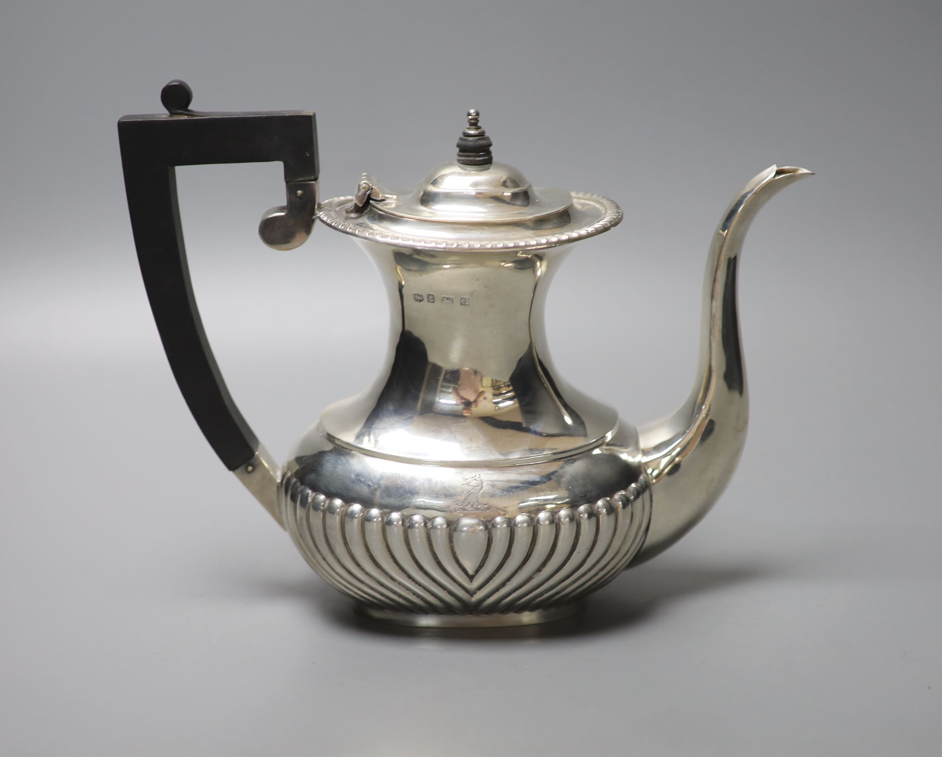 A George V demi fluted silver coffee pot, S. BLanckensee & Sons, Birmingham, 1930, height 17.8cm, gross 14oz.